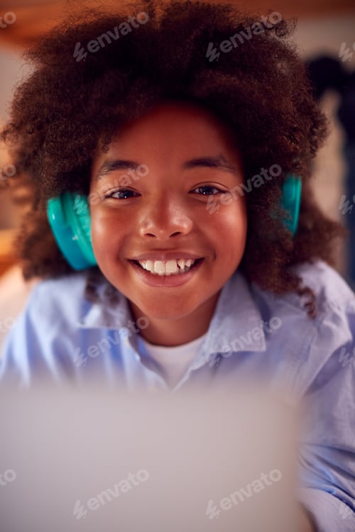 Preview: Portrait Of Boy In Bedroom At Night Lying On Bed Using With Laptop