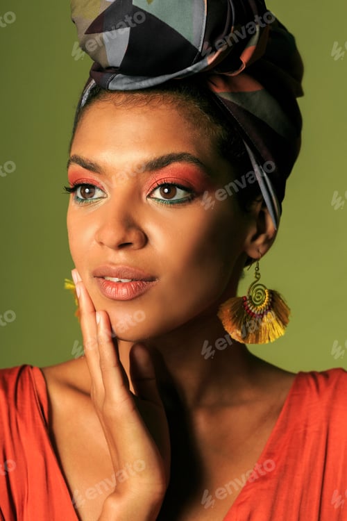 Preview: Beauty portrait ofStylish woman with colorful turban in studio.