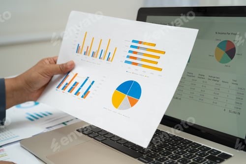 Preview: Asian business woman working with financial graph.