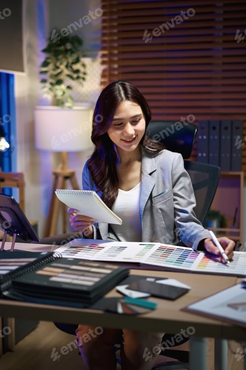 Preview: interior designer woman working on new house project in office. choosing materials