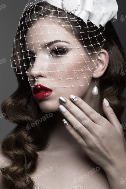 Preview: Elegant lady in fur coat with veil and nail Design. Winter image. Beauty face.