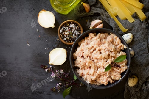 Preview: Minced meat and ingredients for cooking minced meat in a bowl on a slate.