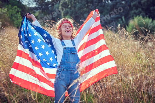 Preview: Positive child with flag of USA enjoying sunlight in countryside