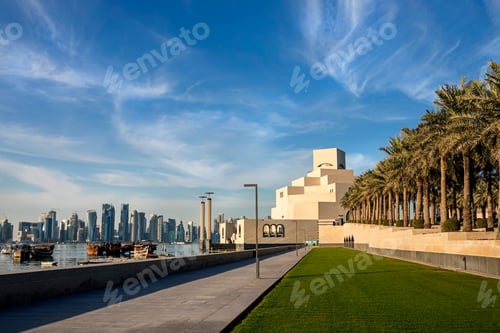 Preview: Seafront of Doha skyline and Museum of Islamic Art view during sunny day Doha, Qatar