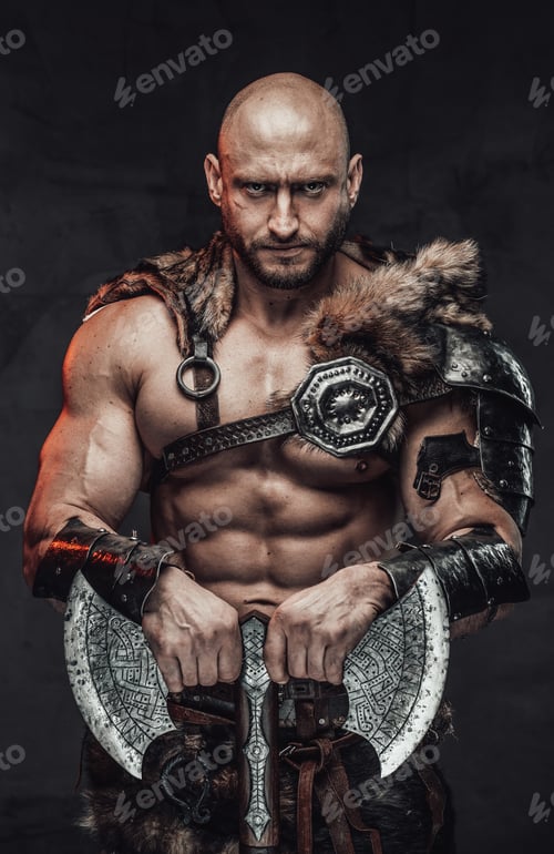 Preview: Serious bald viking posing in dark background with double axe