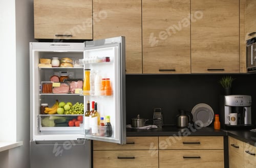 Preview: Open refrigerator full of products in kitchen