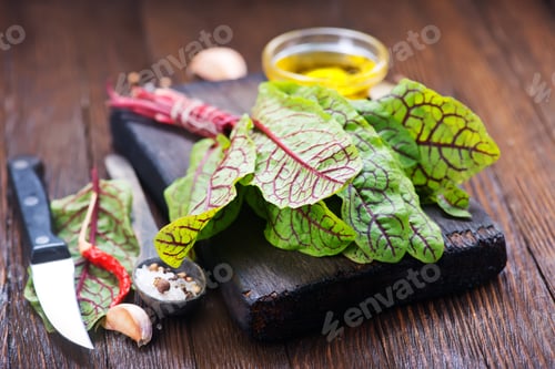 Fresh Greens and Herbs on Wooden Cutting Board