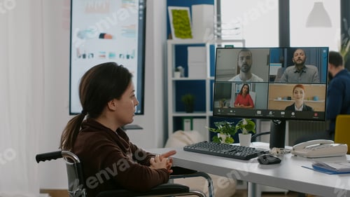 Preview: Immobilized manager woman speaking online with remotely coworker