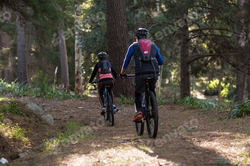Preview: Biker Couple Cycling In Countryside Forest