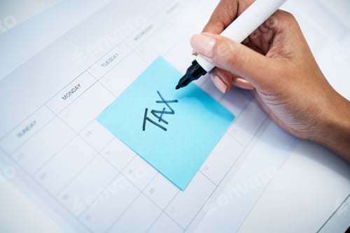 Preview: Hand closeup, notes and tax on calendar with finance, law and compliance for money administration.