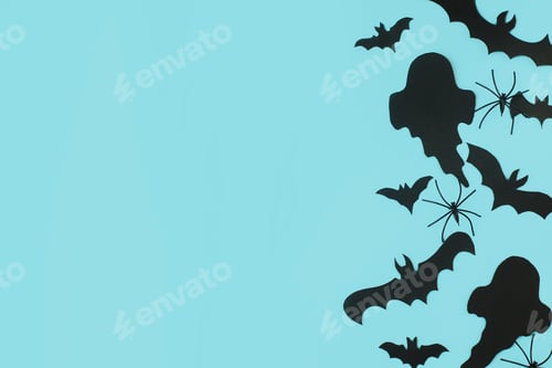 Preview: Happy Halloween. Black ghosts, spiders and bats decorations on blue background flat lay