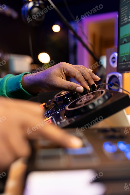 Preview: Young artist sound designer mixing and mastering tunes on stereo console