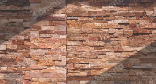 Preview: Background of brown and white Cladding Stone Brick Fence Wall with sunlight and shadow on surface