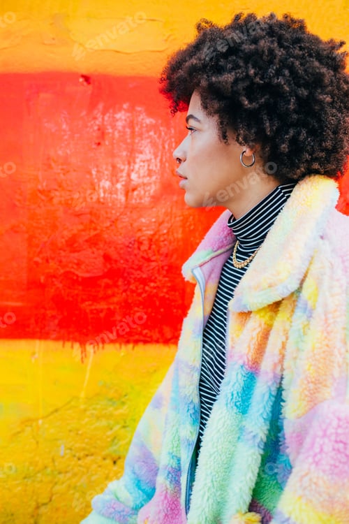 Preview: Profile portrait young black woman posing outdoor