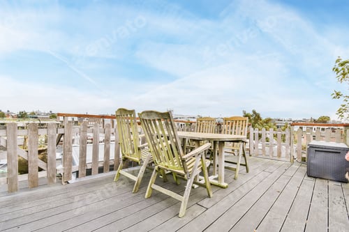 Preview: Balcony with wooden chairs and table