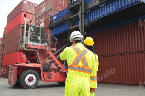 Preview: Workers oversee cargo handling operations at shipping yard during daylight hours