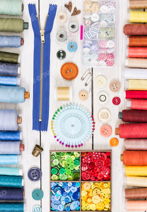 Preview: Tools for sewing on light wooden background.