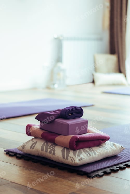Preview: Empty yoga studio interior with mats and accessories. Copy space. Vertical shot.