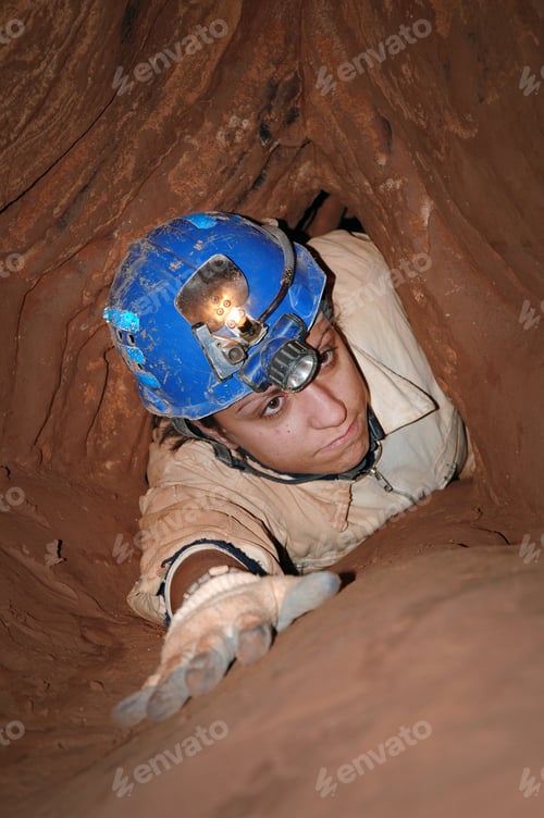 Preview: Narrow cave passage with a caver