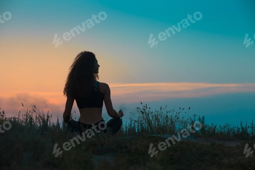 Preview: The Silhouette Of Young Woman Is Practicing Yoga