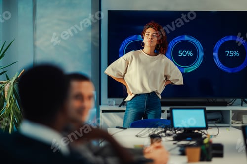 Preview: Hispanic female team leader with authority speaking at office brainstorming