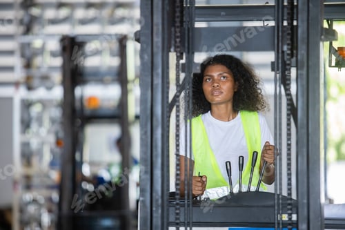 Preview: woman wear safety helmet stand beside forklift warehouse in factory. Male worker industrial operate.