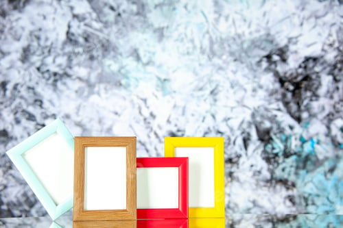 Preview: front view different picture frames with colored corners on the light background present family