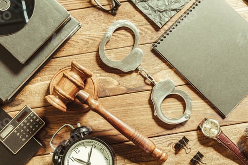 Preview: Items on a wooden table for a court case preparation and police investigation process