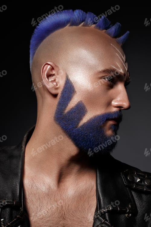 Preview: Young man with blue hair and creative makeup and hair.
