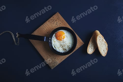 Preview: Top view tasty healthy breakfast: spiced with pepper fried egg