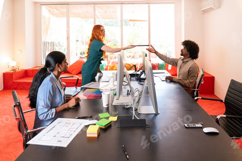 Preview: Multiethnic small group of businesspeople meeting in a coworking company office