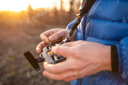 Preview: Person holding remote controller