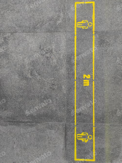 Preview: Top view of a yellow 2m social distancing sign on the ground - COVID-19