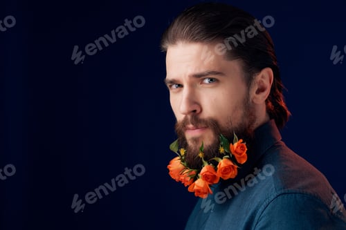 Preview: portrait of a man with flowers in a beard in a black shirt dark background