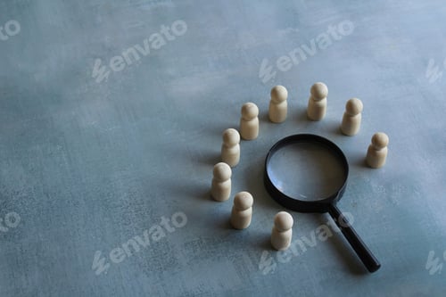 Preview: Wooden dolls and magnifying glass.