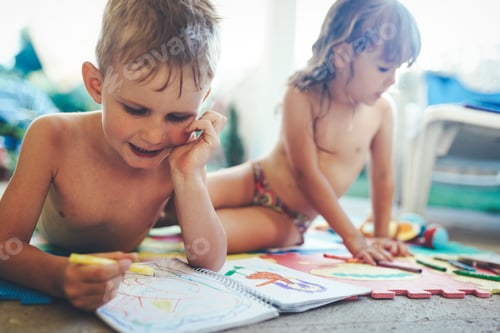 Preview: Little boy and girl drawing with crayons