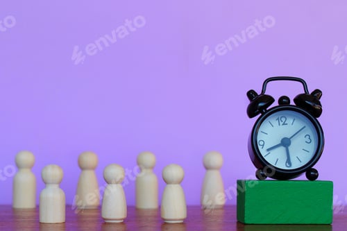 Preview: Alarm clock and wooden dolls on purple background.