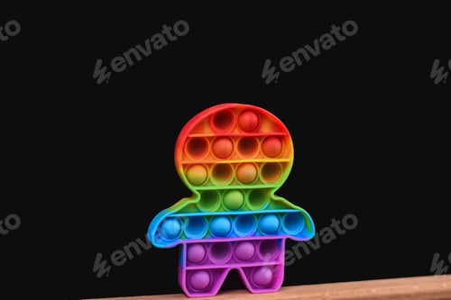 Preview: Rainbow Pop it in the form of a man on a black background.
