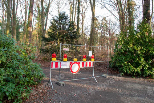Preview: Closed park with stop symbols after a storm. Germany