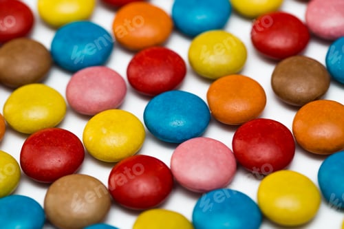Preview: Close up of a pile of colorful chocolate coated candy, chocolate pattern, chocolate background