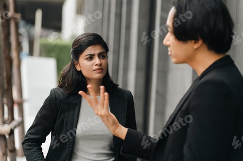 Preview: Business people discussing outdoors