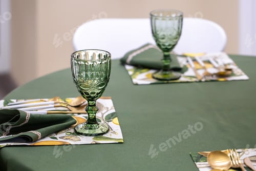 Preview: Dinner table setting idea with textured green glass goblets.
