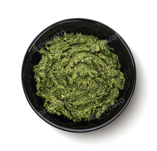 Preview: Pesto in black bowl isolated on white background, top view