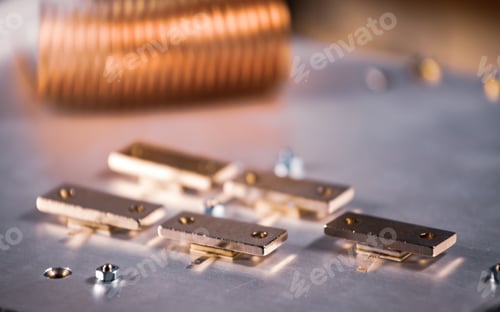 Preview: Close-up of five metal plates on a large iron case