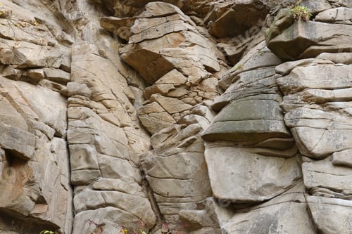 Preview: Light coarse natural rock stone background. Mining cliff rough front surface