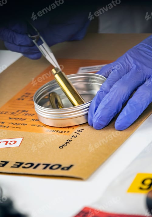 Preview: Criminalistic Laboratory, Scientific police officer holds bullet tips