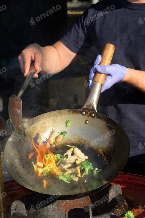 Preview: Chef cooks Chinese noodle wok at street food festival