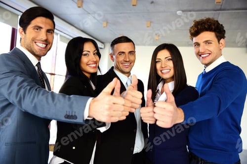 Preview: Cheerful Young Business Team With Thumbs Up Sign