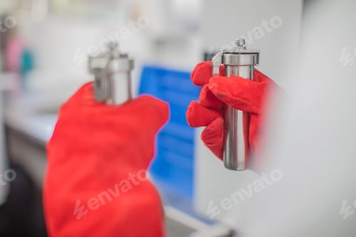 Preview: Hand in red glove cleaning with spray bottle