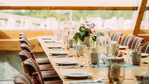 Preview: Cozy Interior Of Summer Cafe. Jug Of Icy Cold Ice Water On Table And Cutlery Laid Out